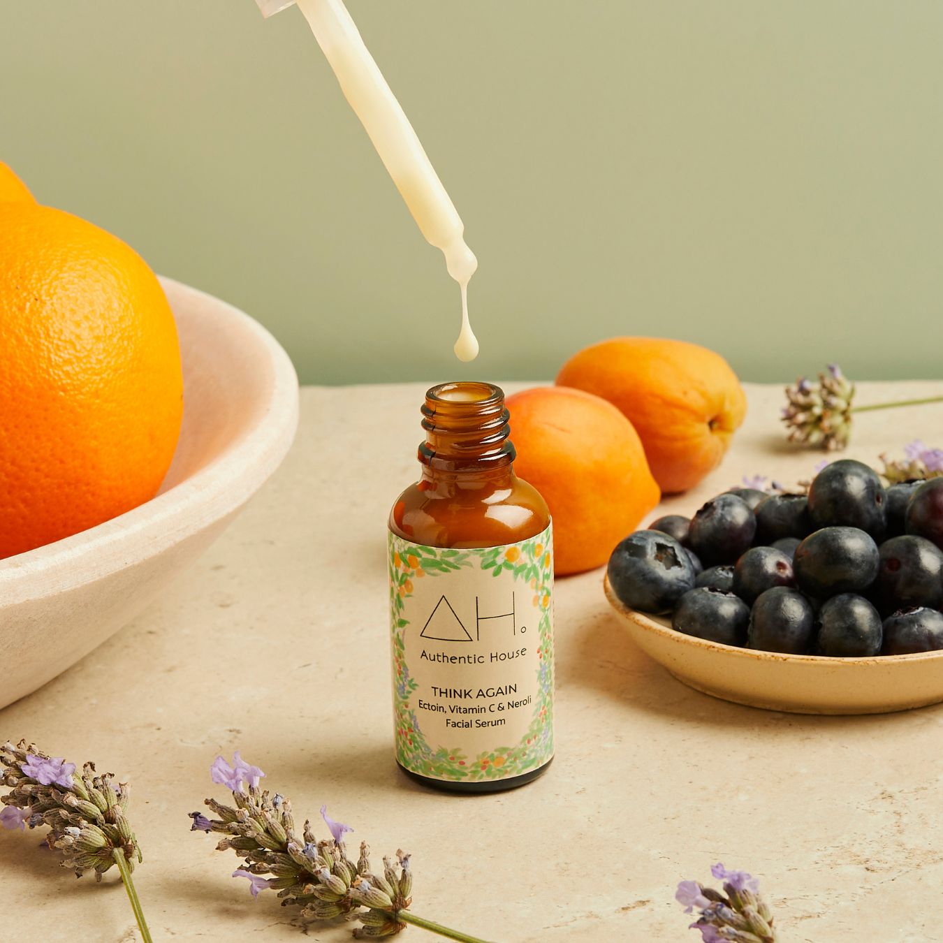 Think Again Facial Serum with dropper, oranges and blueberries