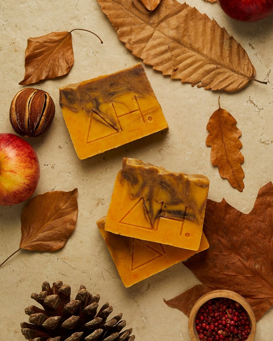 Spiced orange soaps with leaves and apples