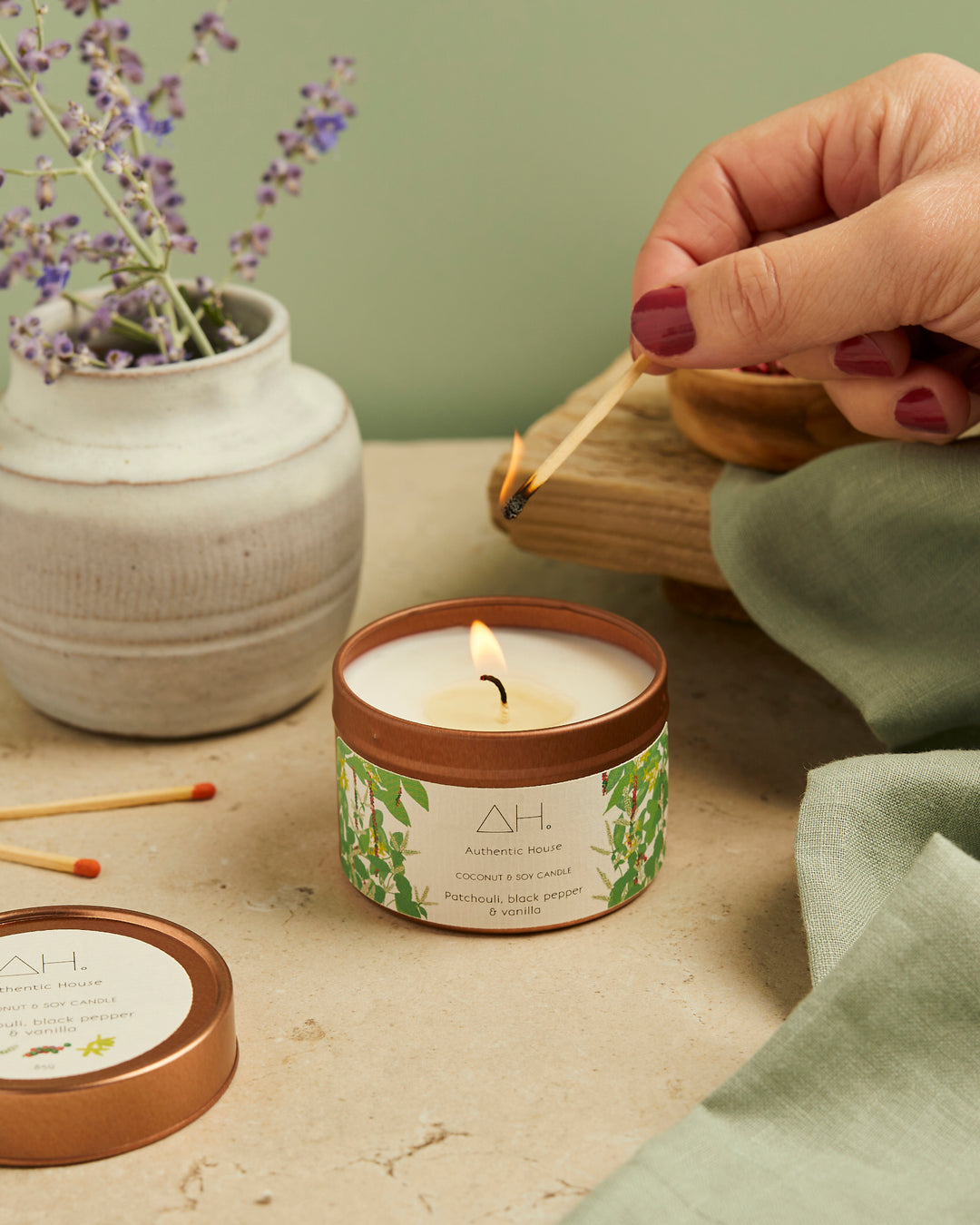 Patchouli candle being lit with match