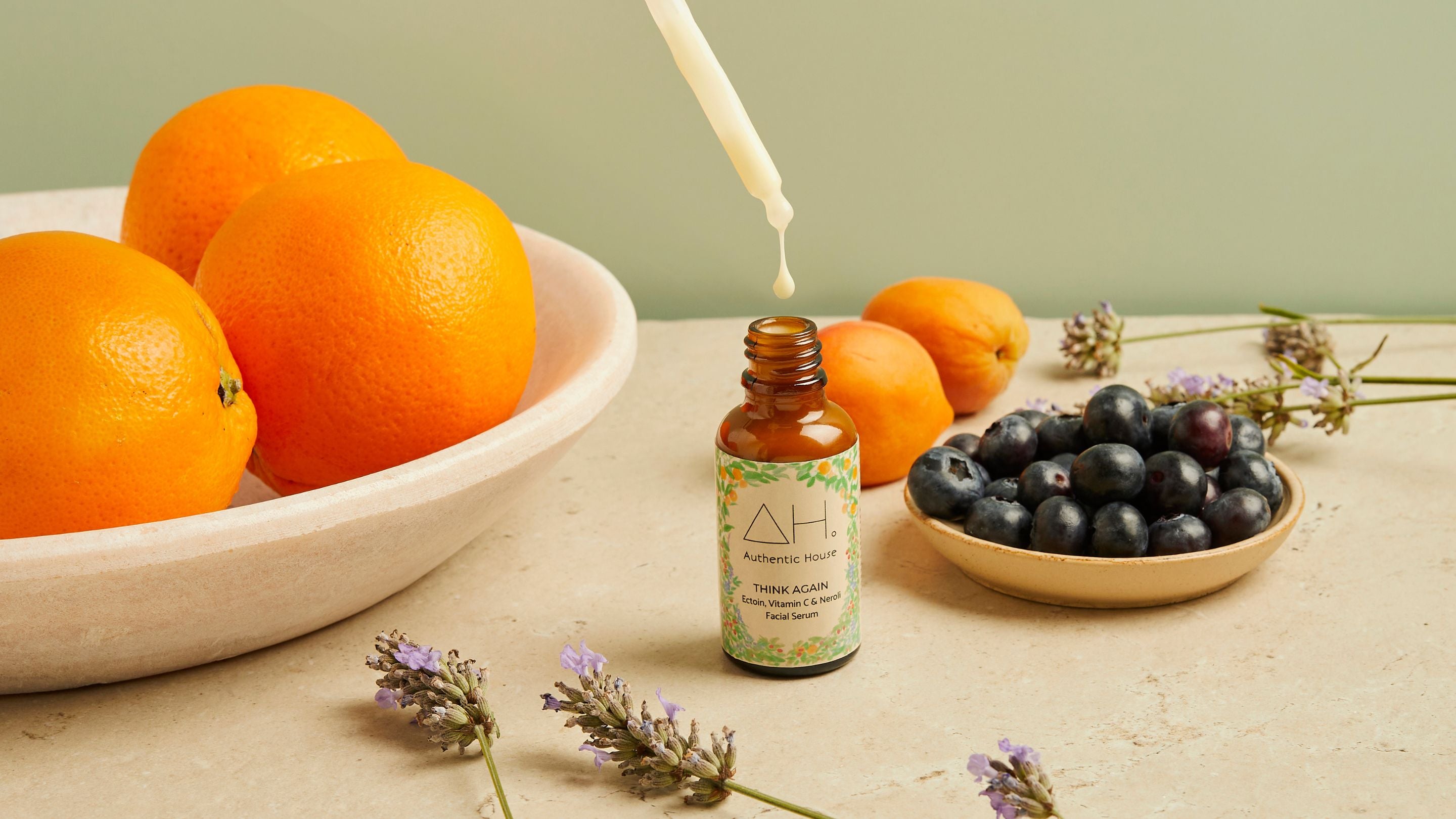 Think Again Facial Serum with dropper, oranges and blueberries